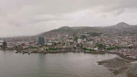 Aerial-footage-of-the-coast-of-downtown-Freetown,-Sierra-Leone
