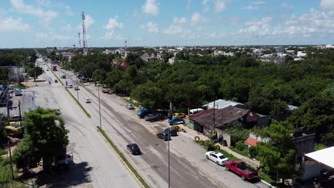 Light-traffic-on-highway-road-in-Tulum-Mexico-on-sunny-summer-day,-aerial