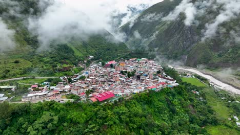 Aerial-Drone-Fly-View-Von-Santa-Teresa-Town-City-Village-Green-Rainforest-Valley-Andes-Mountains-Hydroelectric-Hot-Water-Machu-Picchu-Peru-South-America
