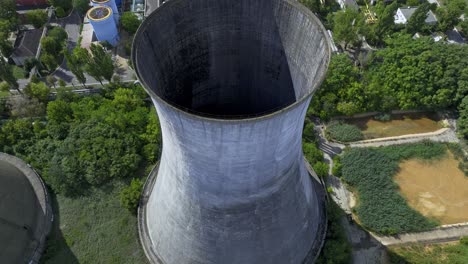 Aerial-View-Hyperboloid-Cooling-Tower-Of-HeidelbergCement-Militari-Concrete-Plant-In-Bucharest,-Romania