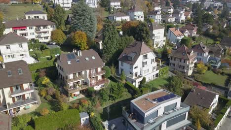 Drone-aerial-view:-neighbourhood-in-Lausanne-town:-individual-houses,-villas-in-the-capital-city-,Vaud,-Switzerland