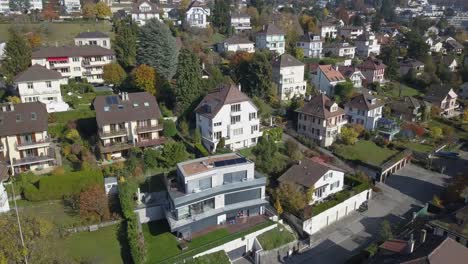 Drone-panning-shot:-Lausanne,-residential-neighborhood-in-the-town,-trees-and-houses,-urban-environment,-Switzerland,-Vaud
