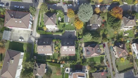 Top-drone-aerial-view:-Residential-area-in-a-Lausanne-neighborhood:-Houses-and-trees