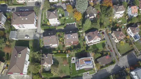 Drone-aerial-view:-Residential-neighborhood-in-a-Lausanne:-Houses,-roads-and-trees