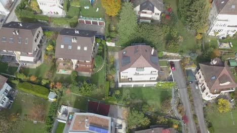 Lausanne,-residential-neighborhood-viewed-from-the-sky,-houses-with-tile-rooftops-drone-aerial-view,-urban-environment,-Switzerland,-Vaud