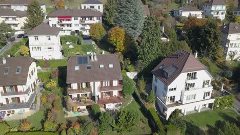 Drone-aerial-view:-neighbourhood-in-Lausanne:-individual-houses-and-garden-in-the-capital-city-,Vaud,-Switzerland