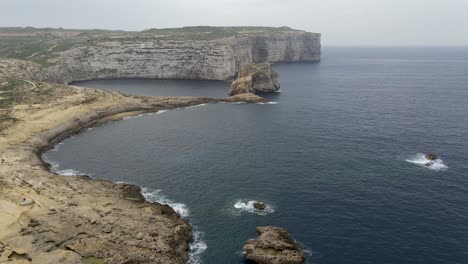 Aerial-4k-drone-video-of-The-Dwejra-Bay-at-the-northwestern-end-of-the-island-of-Gozo,-Malta