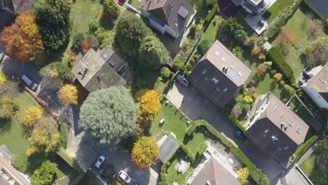 Dwellings,-buildings,-roads-and-garden-in-Lausanne,-the-capital-city-in-Vaud,-Switzerland,-drone-top-view
