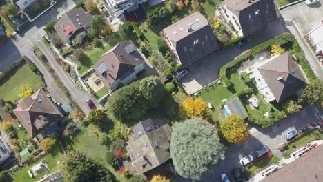 Top-drone-aerial-view-of-houses-and-trees-in-Lausanne,-a-town-in-Vaud,-Switzerland