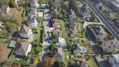 Dwellings,-buildings-and-trees-in-Lausanne,-the-capital-city-in-Vaud,-Switzerland,-drone-aerial-view