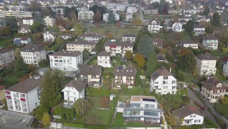 Lausanne,-residential-area-of-the-city,-houses-and-buildings-surrounded-by-gardens,-drone-aerial-view,-urban-environment,-Switzerland,-Vaud