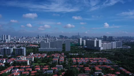 Aerial-tracking-shot-of-Saigon-City-Skyline-from-Phu-My-Hung-area-of-Ho-Chi-Minh-City,-Vietnam-on-a-beautiful-sunny-morning