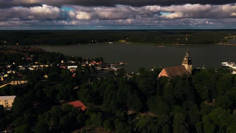 Aerial-view-of-the-church-and-old-town-Naantali,-summer-in-Finland---tracking,-drone-shot