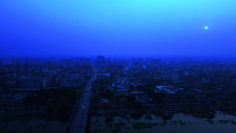 Night-aerial-view-of-desolated-Apocalyptic-urban-city-suburbs,-blue-sky-dusk
