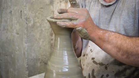 4K-Footage-of-ceramic-manufacture-man-making-handcrafted-pottery-in-a-factory-1