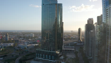 Aerial-decent-looking-toward-Southbank-skyscrapers-on-gorgeous-Melbourne-afternoon