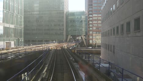 Canary-Wharf-London-England-September-2022-rear-view-of-DLR-train-as-it-comes-into-Canary-Wharf-station