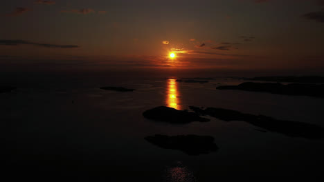 Aerial-view-of-a-silhouette-archipelago,-in-Kristansund,-Norway---tracking,-drone-shot