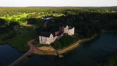 Aerial-view-towards-the-Kastelholm-castle,-sunny-evening-in-Aland,-Finland