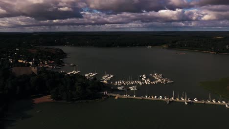 Aerial-view-of-the-marina-and-old-town-Naantali,-summer-in-Finland---circling,-drone-shot