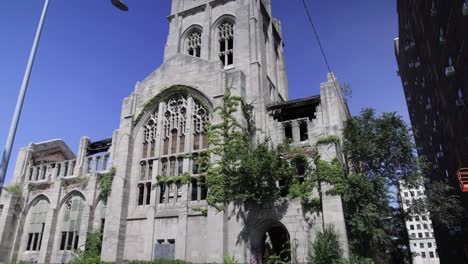 Abandoned-historic-City-Methodist-Church-in-Gary,-Indiana-with-gimbal-video-walking-forward-in-slow-motion