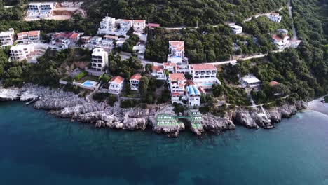 Luxury-seaside-apartment-buildings-on-shore-of-Montenegro,-aerial