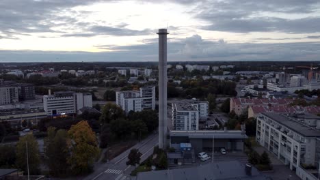Tall-chimney-in-a-suburban-area.-Drone-shot