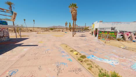 FPV-drone-shot-of-abandoned-Lake-Dolores-Waterpark-In-Mojave-Desert,-California-1