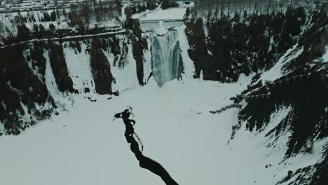 Quebec-City-Canada-waterfall-during-winter-time-with-snow-drone-video