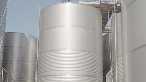 Detail-tilt-shot-of-wine-tank-in-a-winery-in-spain-in-slow-motion-60fps