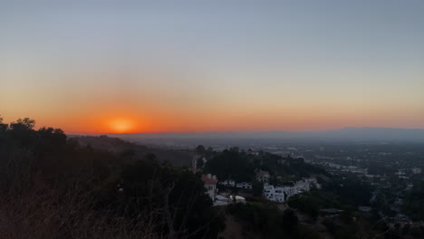 Sunset-Over-Distant-Village-In-Los-Angeles,-California---wide