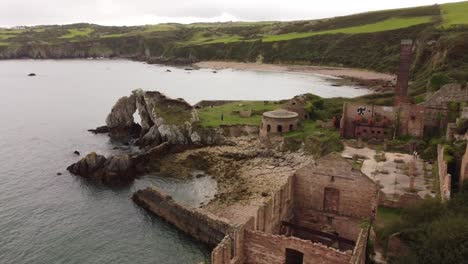 Porth-Wen-aerial-view-across-abandoned-Victorian-industrial-brickwork-factory-remains-on-Anglesey-eroded-coastline