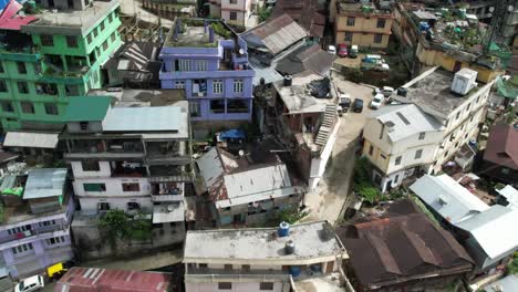 Aerial-right-pan-shot-of-Kohima-city-filled-with-buildings-and-roads