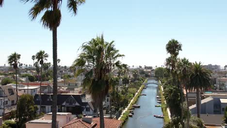Aerial-View-Of-Venice-Canal-Historic-District-On-Sunny-Day-With-Palm-Trees