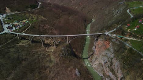 Drone-footage-overlooking-the-entire-Durdevica-Tara-bridge-in-Montenegro-with-cars-driving-over-it