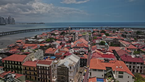 Panama-City-Aerial-v104-low-flyover-casco-viejo-historic-district-capturing-old-quarter-town-with-spanish-colonial-architectures-and-orange-roof-building-complex---Shot-with-Mavic-3-Cine---April-2022