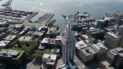 Aerial-shot-of-Smith-Tower-standing-high-above-the-Pioneer-Square-neighborhood-in-Seattle