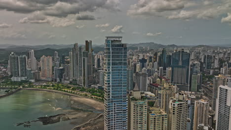 Panama-City-Aerial-v8-panoramic-view-capturing-oceanfront-cityscape-across-marbella,-punta-paitilla-and-pacifica-neighborhoods-and-man-made-ocean-reef-islands---Shot-with-Mavic-3-Cine---March-2022