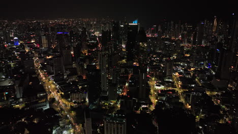 Panama-City-Aerial-v90-birds-eye-view-pull-out-shot-capturing-traffics-on-avenue-central-espana-and-downtown-night-cityscape-across-la-cresta-and-campo-alegre---Shot-with-Mavic-3-Cine---April-2022