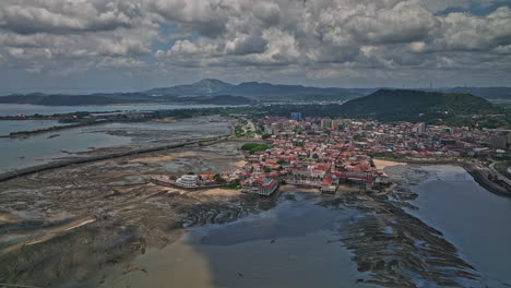 Panama-City-Aerial-v106-reverse-flyover-capturing-historic-district-surrounded-by-mudflats-and-cinta-costera-3-costal-beltway-with-ancon-hill-in-the-background---Shot-with-Mavic-3-Cine---April-2022