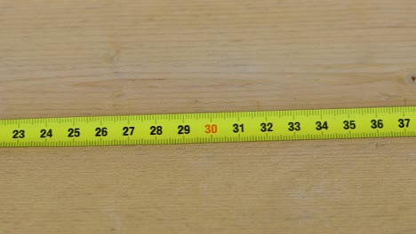 Shot-of-a-measuring-tape-from-left-to-right,-from-0-to-70