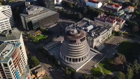 Beautiful-aerial-orbit-of-Beehive,-iconic-parliament-building-in-Wellington,-New-Zealand