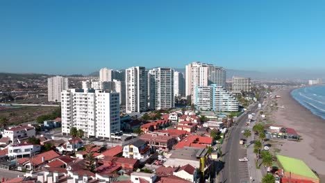 Aerial-view-dolly-in-of-vacation-buildings-near-the-Costanera-beach-in-La-Serena,-Chile