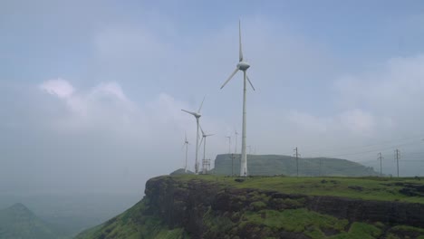 Wind-Turbines-Spinning-On-Top-Of-Mountain-In-Sahyadri,-Western-Ghats-Mountain-Range-In-India