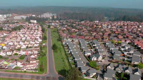 Aerial-view-dolly-in-of-exclusive-but-very-similar-condominiums,-housing-complexes-in-Curauma,-Chile