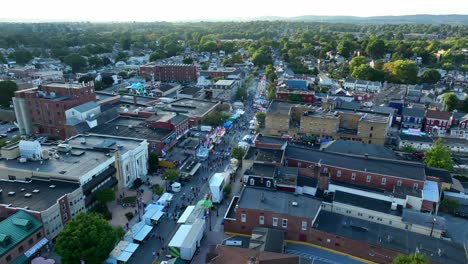 Aerial-orbit-of-street-fair-carnival-in-small-town-America