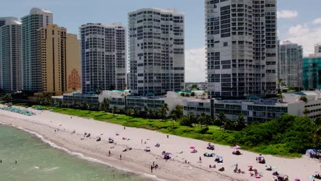 Aerial-Pan-Sunny-Isles-Beach-skyline-in-Sunny-Isles,-Florida-Drone