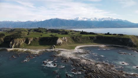 Kaikoura-Peninsula-and-snow-capped-Southern-Alps-on-New-Zealand-coastal