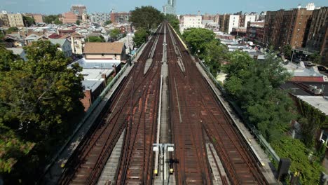 An-aerial-view-of-empty,-elevated-train-tracks-on-a-sunny-day