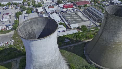 Drone-flight-above-natural-draft-cooling-towers---Heidelberg-Cement-plant-in-Bucharest,-Romania